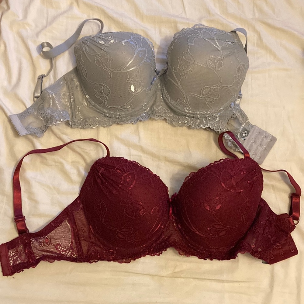 Two brand new 36D lacey underwire bras. Burgundy and grey.